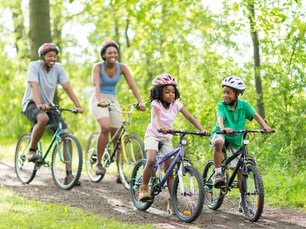 Parents and kids cycling.