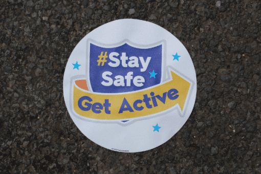 Stay Safe Get Active Pavement Sticker on the pavement.