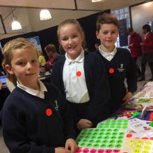 School children with active travel stickers on their uniform