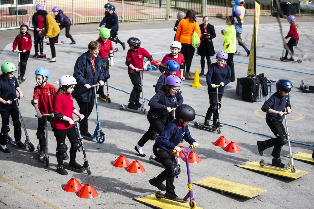 People on scooters.