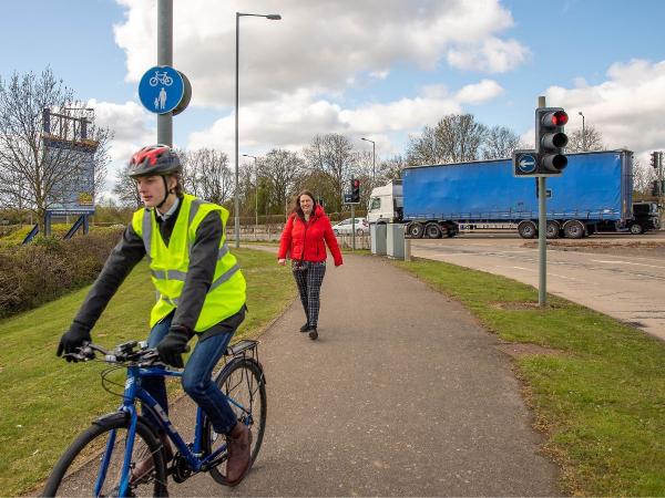 Man on a bicycle.