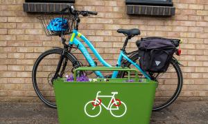 Bicycle at a planter rack.