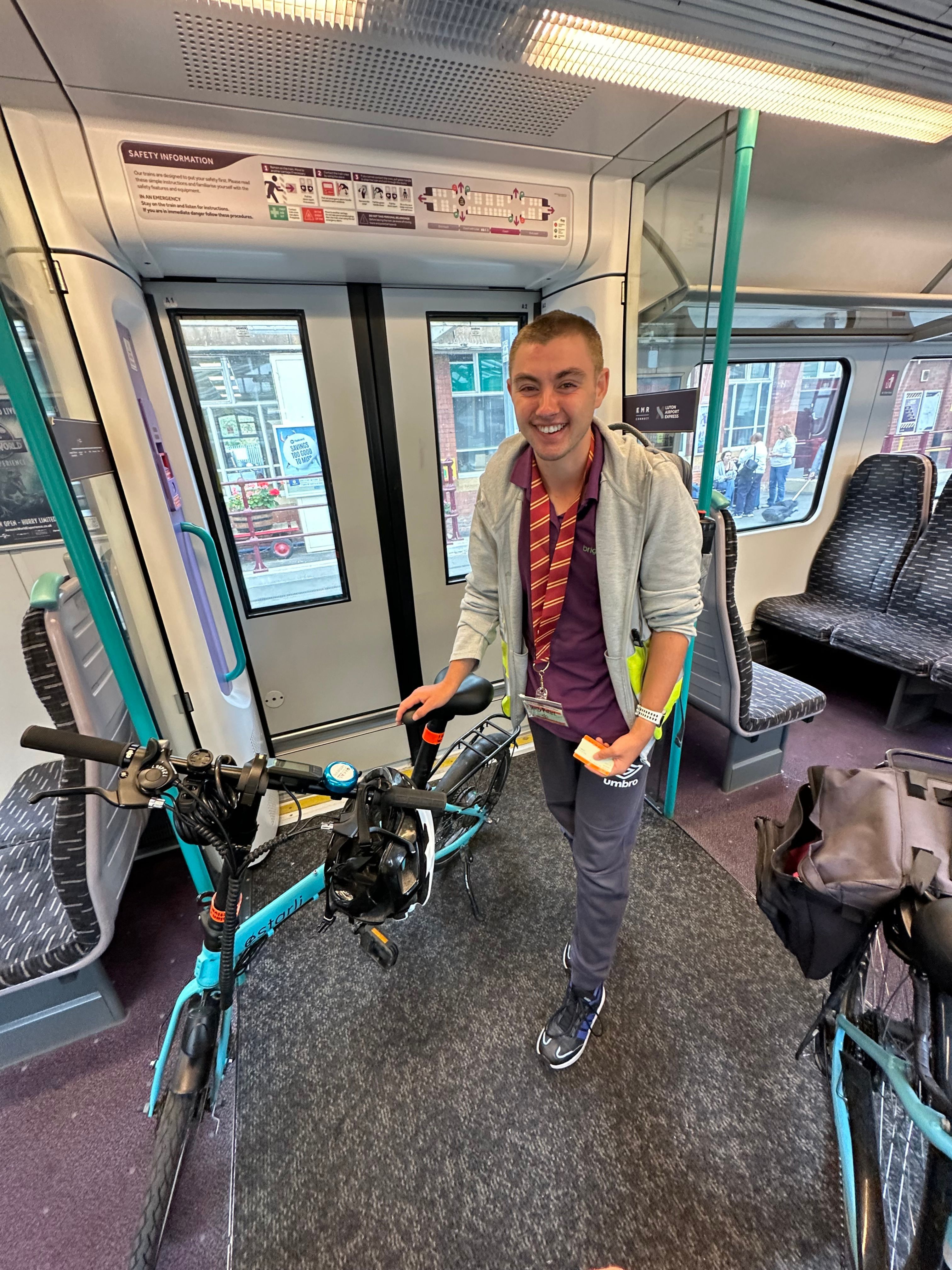 Ryan with his bike on a train.