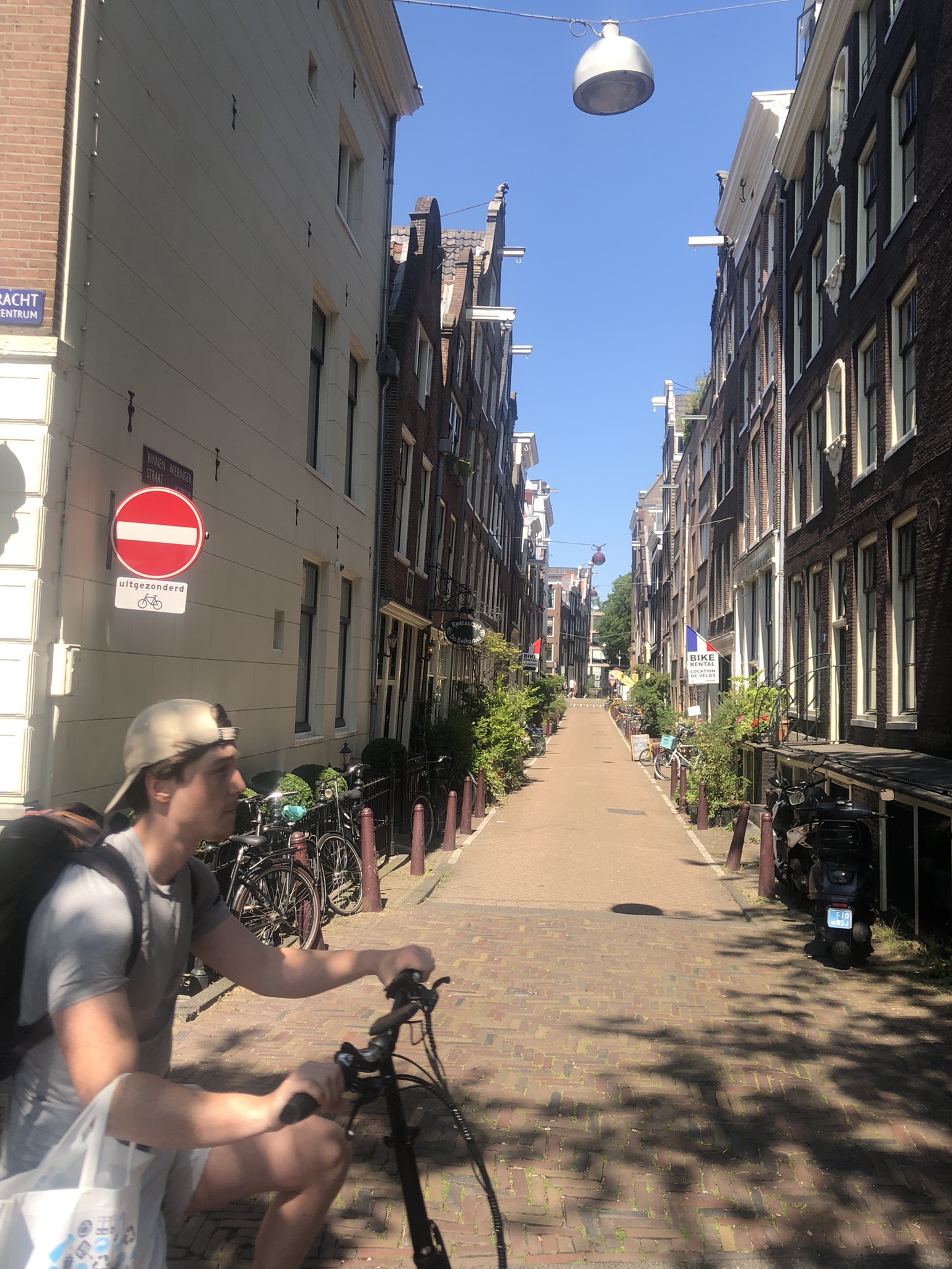 Quiet street and cyclist in Amsterdam 