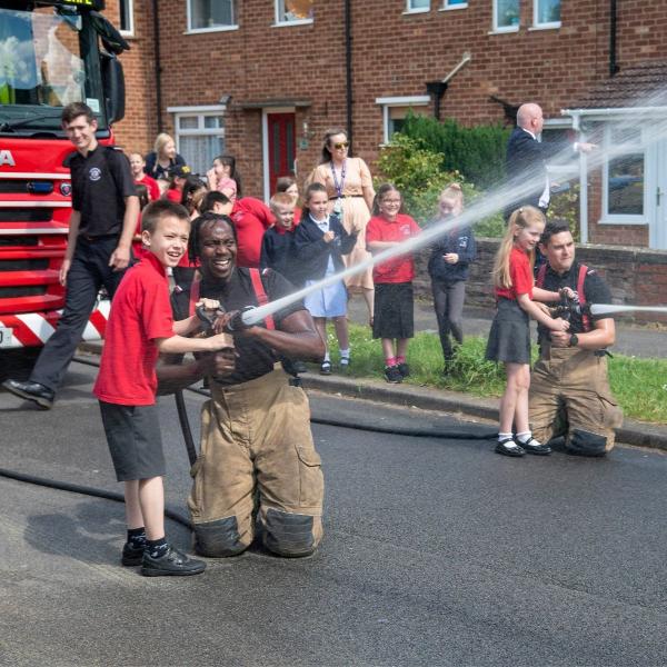 Fire fighters and kids.