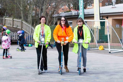 Alison and teachers on scooters.