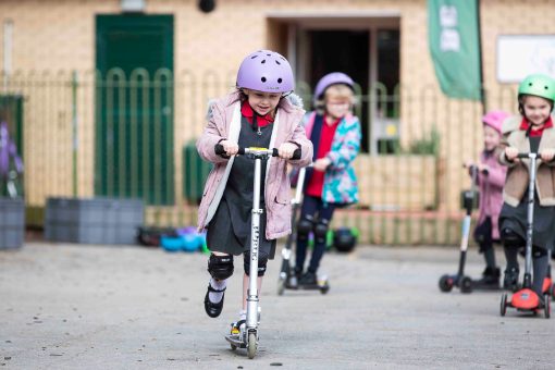 Girl on scooter.