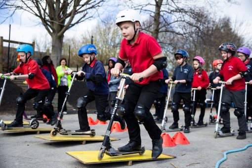 Kids on scooters.