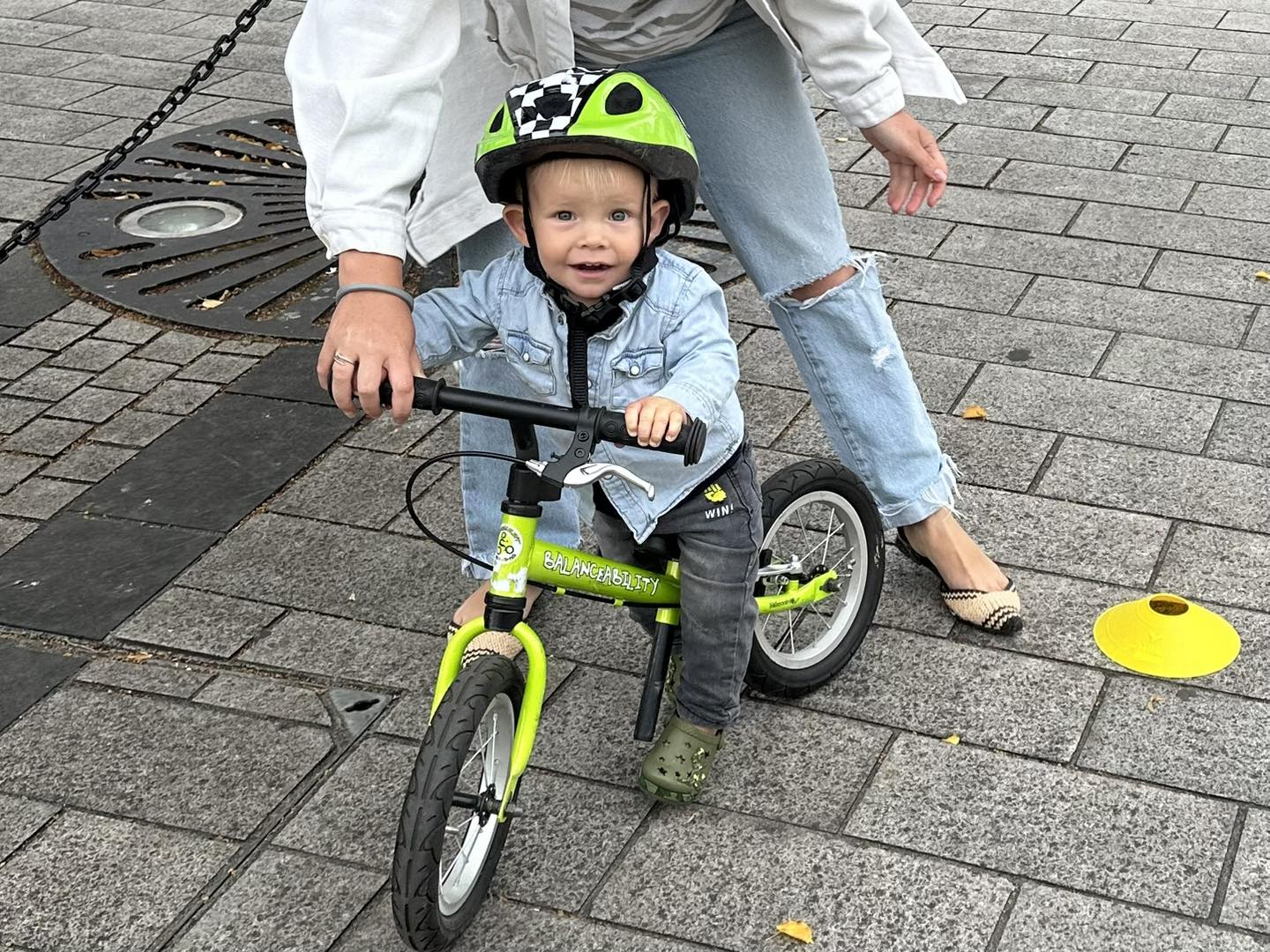 Happy toddler on balance bike.