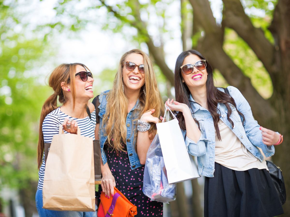 3 shoppers smiling